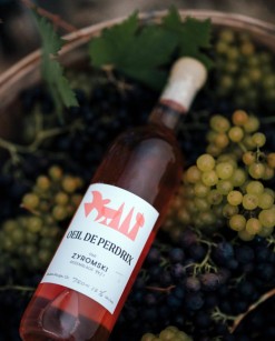 Bottle of rosé wine, L'Oeil de perdrix, with pink graphic elements on the label.